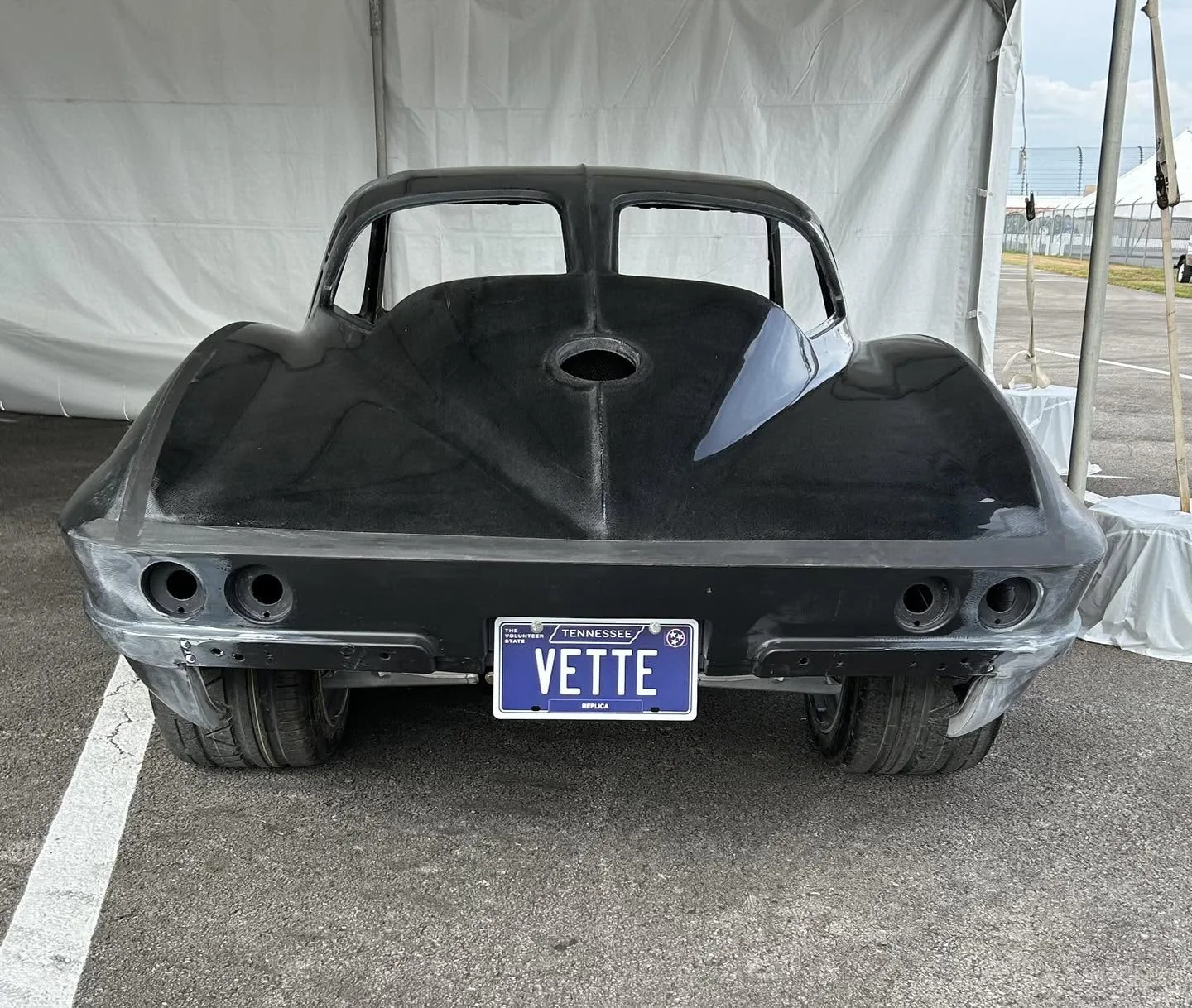 Bare Corvette body shell under construction.