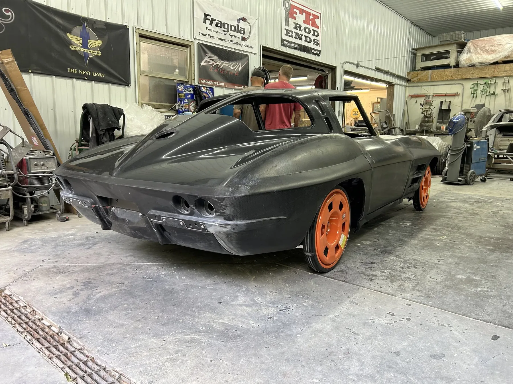 Corvette body side view inside the workshop.