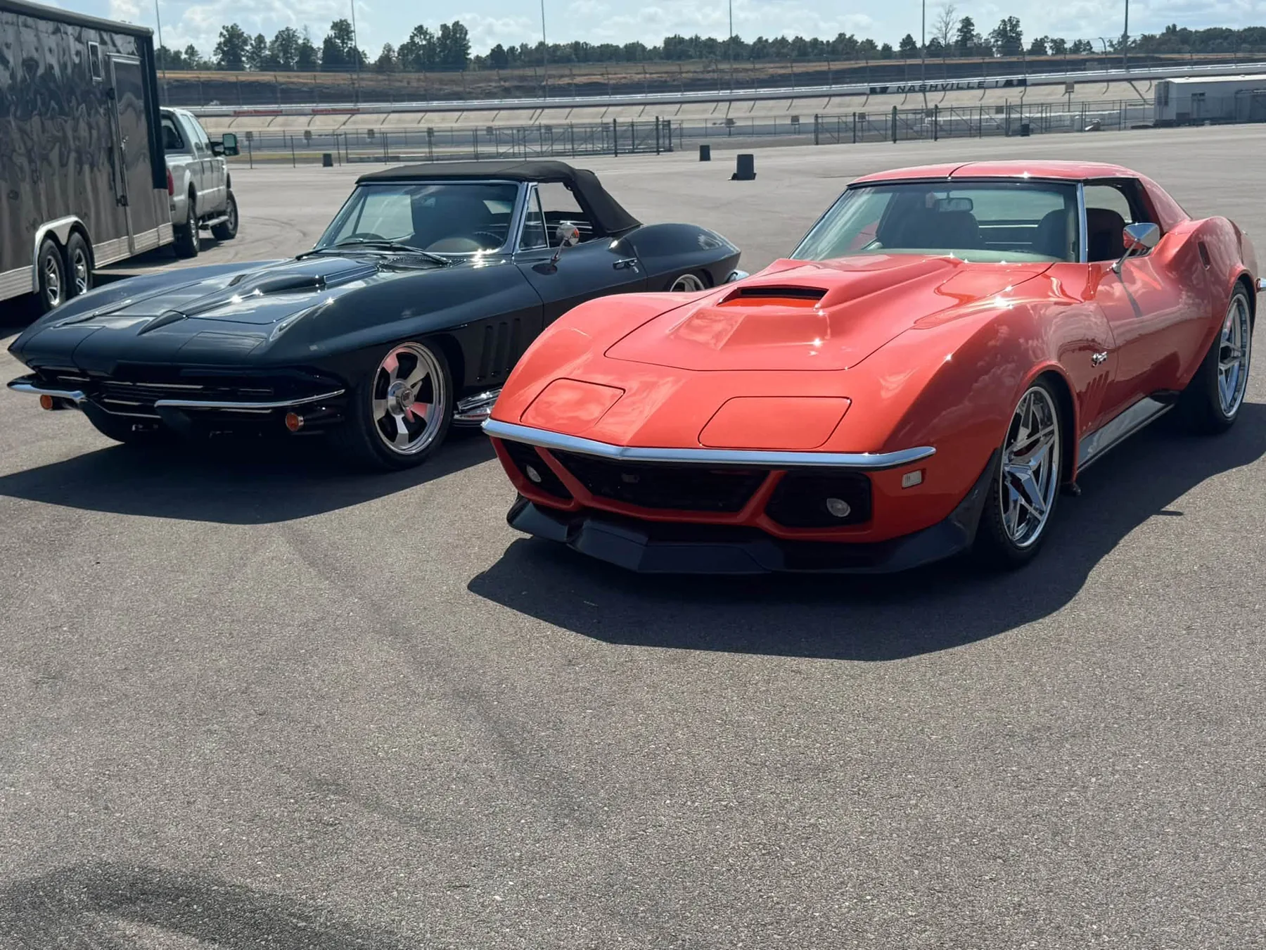 Red and blue Corvettes on display.