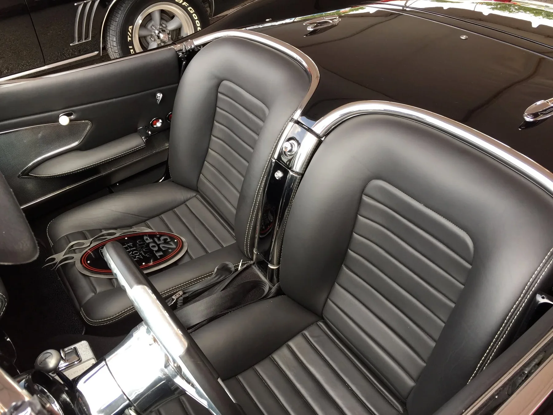 Classic Corvette cockpit with molded custom seat pods and chrome waterfall.