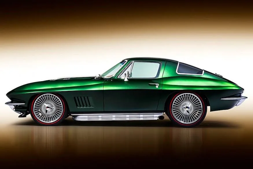 Finished dark green metallic C2 Corvette split-window coupe studio side profile.